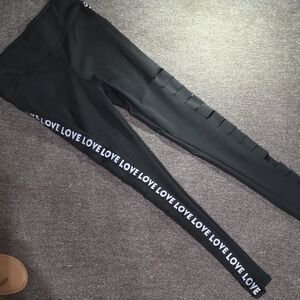 Black Slitted Leggings With Love Printed Down Sides